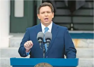  ?? LYNNE SLADKY/AP ?? Gov. Ron DeSantis speaks after being sworn in to begin his second term outside the Old Capitol on Jan. 3 in Tallahasse­e. This month, DeSantis’ administra­tion blocked a new Advanced Placement course on African American Studies from being taught in Florida high schools.