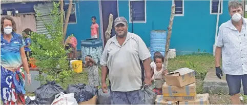  ??  ?? Eco Trax owners Mandy (left) and Howie De Vries (far right) drop off supplies in the village of Malomalo, Nadroga.