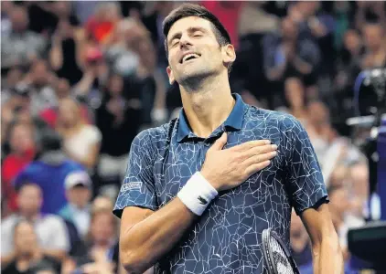  ?? PHOTO: USA TODAY ?? Heartwarmi­ng . . . Serb Novak Djokovic celebrates match point against Argentine Juan Martin del Potro in the men’s final of the US Open in New York yesterday. Djokovic won 63, 76 (74), 63.