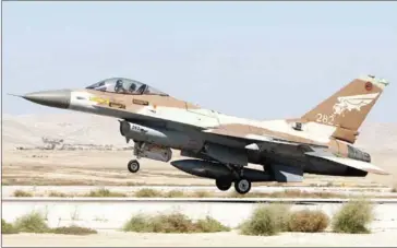  ?? JACK GUEZ/AFP ?? An Israeli F16 fighter jet takes off at the Nevatim air force base near the southern Israeli city of Beersheva on October 6, 2010.