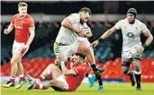  ??  ?? On the charge: Billy Vunipola takes the game to Wales