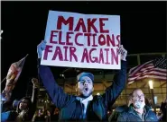  ?? (AP PHOTO/DAVID GOLDMAN, FILE) ?? FILE - In this Nov. 5, 2020, file photo, Jake Contos, a supporter of President Donald Trump, chants during a protest against the election results outside the central counting board at the TCF Center in Detroit. President Donald Trump and his allies have fomented the idea of a “rigged election” for months, promoting falsehoods through various media and even lawsuits about fraudulent votes and dead voters casting ballots. While the details of these spurious allegation­s may fade over time, the scar it leaves on American democracy could take years to heal.