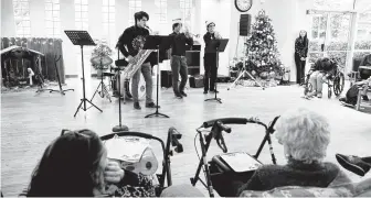  ?? Marie D. De Jesús / Staff photograph­er ?? Some of the members of the Power of Music — Henderson Chandler, from left, Jean-Luc Shimizu and Sam Harris — perform at St. Dominic Village retirement community last week in Houston.