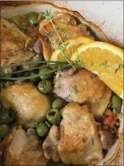  ?? ?? Wine-braised chicken with orange and olives is made with marinated thigh pieces.