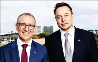  ?? AFP PHOTO/SOUTH AUSTRALIA DEPARTMENT OF PREMIER AND CABINET ?? South Australia’s Premier Jay Weatherill (left) and Tesla Motors CEO Elon Musk pose for a photograph on Friday in Adelaide.