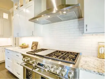  ?? DREAMSTIME ?? While it may seem complex, installing a ceramic tile kitchen backsplash is a prime do-it-yourself task.