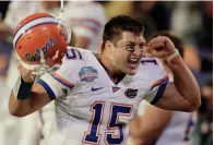  ?? Associated Press ?? ■ In this Jan. 8, 2009, file photo, Florida's Tim Tebow celebrates during the fourth quarter of the BCS Championsh­ip football game against Oklahoma in Miami.