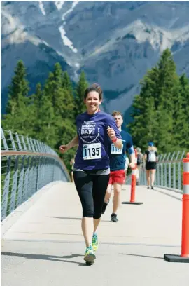  ??  ?? BELOW Amanda Plomp at the 2017 Banff Marathon OPPOSITE BOTTOM Plomp running the 2017 Victoria Marathon