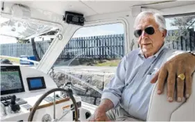  ?? AP PHOTO BY MICHELLE R. SMITH ?? Bob Johnstone, CEO of MJM Yachts, sits inside an MJM boat docked in Newport, R.I.