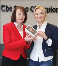  ??  ?? Attracta Conlon receiving the new iPhone on behalf of her daughter Sarah Conlon from Lorraine McDonnell, Business Developmen­t Manager at The Sligo Champion.