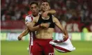  ??  ?? Lazar Randelovic, right, celebrates after scoring his side’s third goal against Krasnodar in the first leg of the Champions League play-off round. Photograph: Thanassis Stavrakis/AP