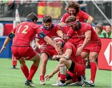 ??  ?? Spanish players celebrate their win over New Zealand.