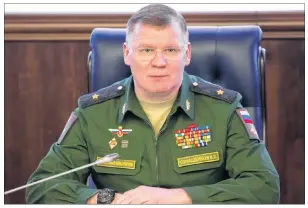  ?? AP PHOTO ?? Russian Defense Ministry spokesman, Maj. Gen. Igor Konashenko­v, speaks at a briefing in Moscow on Friday, April 13. Konashenko­v accused Britain of staging a fake chemical attack in the Syrian town of Douma last weekend.