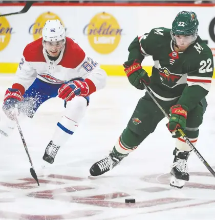  ?? HANNAH FOSLIEN/GETTY IMAGES ?? Minnesota’s Kevin Fiala controls the puck against the Canadiens’ Artturi Lehkonen during the second period of Sunday’s game at Xcel Energy Center in St. Paul, Minn. The Wild overcame a one-goal deficit in the third to win 4-3.