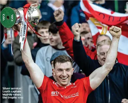  ?? INPHO ?? Silver service: Louth captain Mulroy raises the trophy