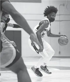  ?? CURT HOGG / NOW NEWS GROUP ?? Martin Luther guard Nacir Beamon (shown in an earlier game) scored 22 points in the victory over Racine St. Catherine's on Saturday.