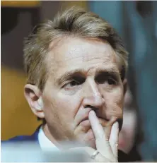  ?? AP PHOTO ?? ‘COUNTRY IS BEING RIPPED APART’: Key player GOP U.S. Sen. Jeff Flake listens at yesterday’s committee meeting.