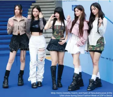  ?? ?? Minji, Hanni, Danielle, Haerin, and Hyein of NewJeans pose at the Ul:kin show during Seoul Fashion Week at DDP in Seoul.