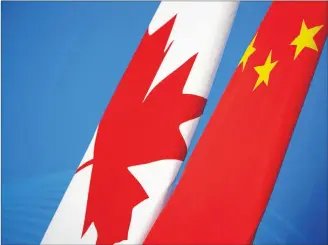  ?? CP PHOTO ?? Flags of Canada and China are placed for the first China-Canada economic and financial strategy dialogue in Beijing, China, last month.