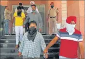  ?? GURMINDER SINGH/HT ?? ■
The accused in Mohali police custody on Sunday. Of the ₹4.79 lakh that was looted, ₹3 lakh have been recovered.