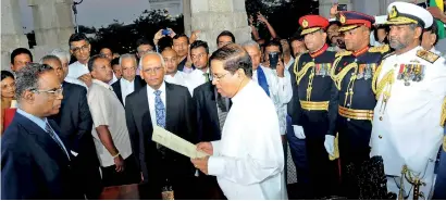  ??  ?? Back then: Maithripal­a Sirisena being sworn in as President