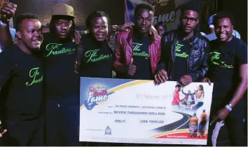  ??  ?? AND THE WINNERS ARE . . . 2017 Chibuku Road to Fame winners The Travellers with their cheque