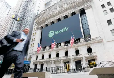  ?? PIcture / AP ?? Spotify shares surged on its NYSE debut this week. Despite its success in gaining massive numbers of subscriber­s Spotify has yet to turn a profit.