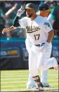  ?? NHAT V. MEYER — STAFF ?? The A’s Yonder Alonso circles the bases after his home run ended the game in the 12th inning.