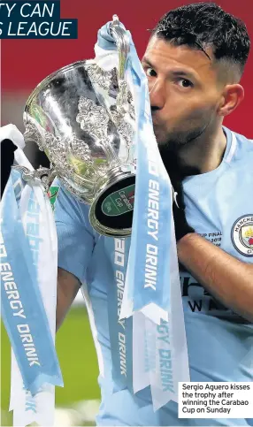  ??  ?? Sergio Aguero kisses the trophy after winning the Carabao Cup on Sunday