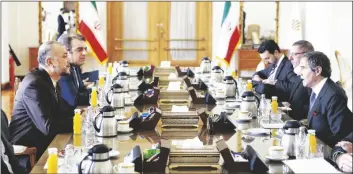  ?? PHOTO VIA AP ?? Internatio­nal Atomic Energy Agency Director-General Rafael Mariano Grossi (right) speaks with with Iran’s Foreign Minister Hossein Amirabdoll­ahian (left) during their meeting in Tehran, Iran, March 5, 2022.