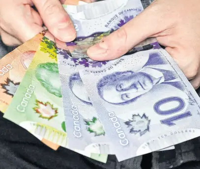  ?? POSTMEDIA NEWS ?? Most Canadians plan to keep cash on hand as the pandemic unfolds.