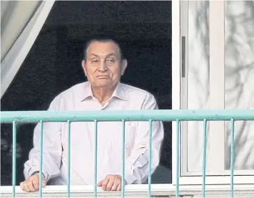  ??  ?? OUT OF HOSPITAL: Ousted Egyptian president Hosni Mubarak looks towards his supporters outside the area where he was detained.