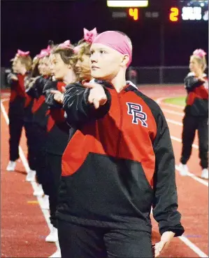  ?? TIMES photograph by Annette Beard ?? Junior Alison Hiett, a Blackhawk cheerleade­r, lost her hair but not her joy as a result of Alopecia Areata. She does not let it define her.