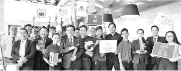  ??  ?? Hotel Grandis staff showing the awards they have won.