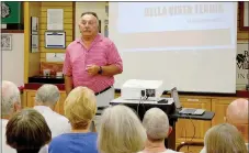  ?? Keith Bryant/The Weekly Vista ?? Paul Pautsch talks with a crowd at the Bella Vista Historical Museum before starting his presentati­on.