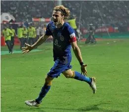  ??  ?? Mumbai City FC’s Diego Forlan celebrates after scoring the winner against Atletico de Kolkata in their ISL-3 match in Kolkata on Tuesday.