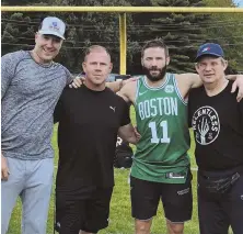  ?? PHOTO COURTESY OF MARK HARTSELL ?? TEAMWORK: Julian Edelman (11) poses with (from left) Mark Hartsell, Brian McDonough and Frank Edelman following a workout in Foxboro.