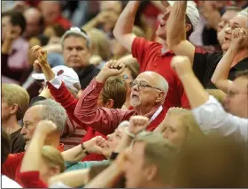  ?? NWA Democrat-Gazette/MICHAEL WOODS ?? University of Arkansas chancellor Joseph Steinmetz, calls the hogs with fans during the Razorbacks game against the Texas Tech Red Raiders on Jan. 30 at Bud Walton Arena in Fayettevil­le.
