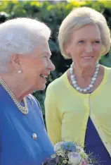  ??  ?? (Right) The Queen with TV cook Mary Berry; (below) being presented with a posy by Caitlyn James, a Year 6 pupil from Swansea; (right) being shown around Chelsea Flower Show