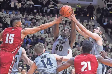  ?? SANDRA DUKES / USA TODAY SPORTS ?? Wisconsin’s Charles Thomas (left) can’t keep Purdue’s Caleb Swanigan from one of his 13 rebounds on Sunday afternoon.