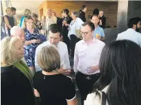  ?? COURTESY MALCOLM LAZIN ?? South Bend, Ind., Mayor Pete Buttigieg, a Democratic presidenti­al candidate, speaks with Gov. Michelle Lujan Grisham at a fundraiser in Santa Fe last weekend.