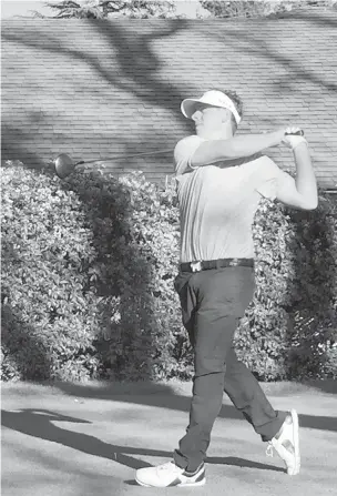  ??  ?? Keaton Gudz tees off on his final hole of Round 2 of the Vancouver Island Open at Uplands Golf Club on Sunday. Gudz and Riley Wheeldon paired up to win the team event.