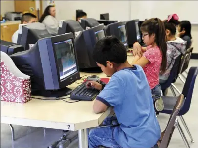  ?? IV PRESS FILE PHOTO Students use the computer lab at Grace Smith Elementary School in Niland. ??