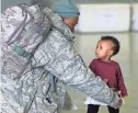  ?? PAUL HELLSTERN/THE OKLAHOMAN VIA AP ?? Tech Sgt. Michael Gilliam greets his 11month-old-daughter, Adelaide, during a homecoming Friday in Oklahoma City for troops back from Turkey.