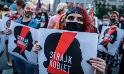  ??  ?? Protesters hold banners reading ‘women’s strike’ as they march in Warsaw against Polish plans to withdraw from the Istanbul convention. Photograph: Wojtek Radwański/AFP/Getty Images