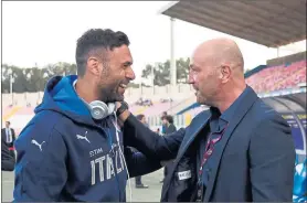  ?? Picture: Getty Images ?? NICE TO SEE YOU: Italy’s Salvatore Sirigu, left, chats with former goalkeeper Walter Zenga prior to kick-off at last night’s friendly.