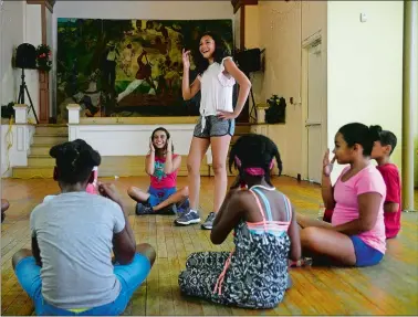  ?? SARAH GORDON/THE DAY ?? Liani Vega, 12, center, plays a game as campers with the Camp Rotary/Summer Summit program take a break from working on community service projects on Aug. 2 at the Centro de la Comunidad in New London. The seven-week program for middle schoolers features academics and recreation­al enrichment.