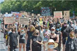  ?? — AFP ?? People attend a “Black Lives Matter” protest in Berlin on Saturday.