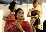  ?? — PRITAM BANDYOPADH­AY ?? Models put on make- up in the backstage during the Northeast festival at Indira Gandhi Centre for Arts in New Delhi on Sunday.