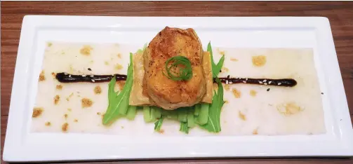  ?? PHOTOS BY MIKE PETERS / CHINA DAILY ?? A seared king oyster mushroom is meaty without pretending to be meat in this spring pancake.